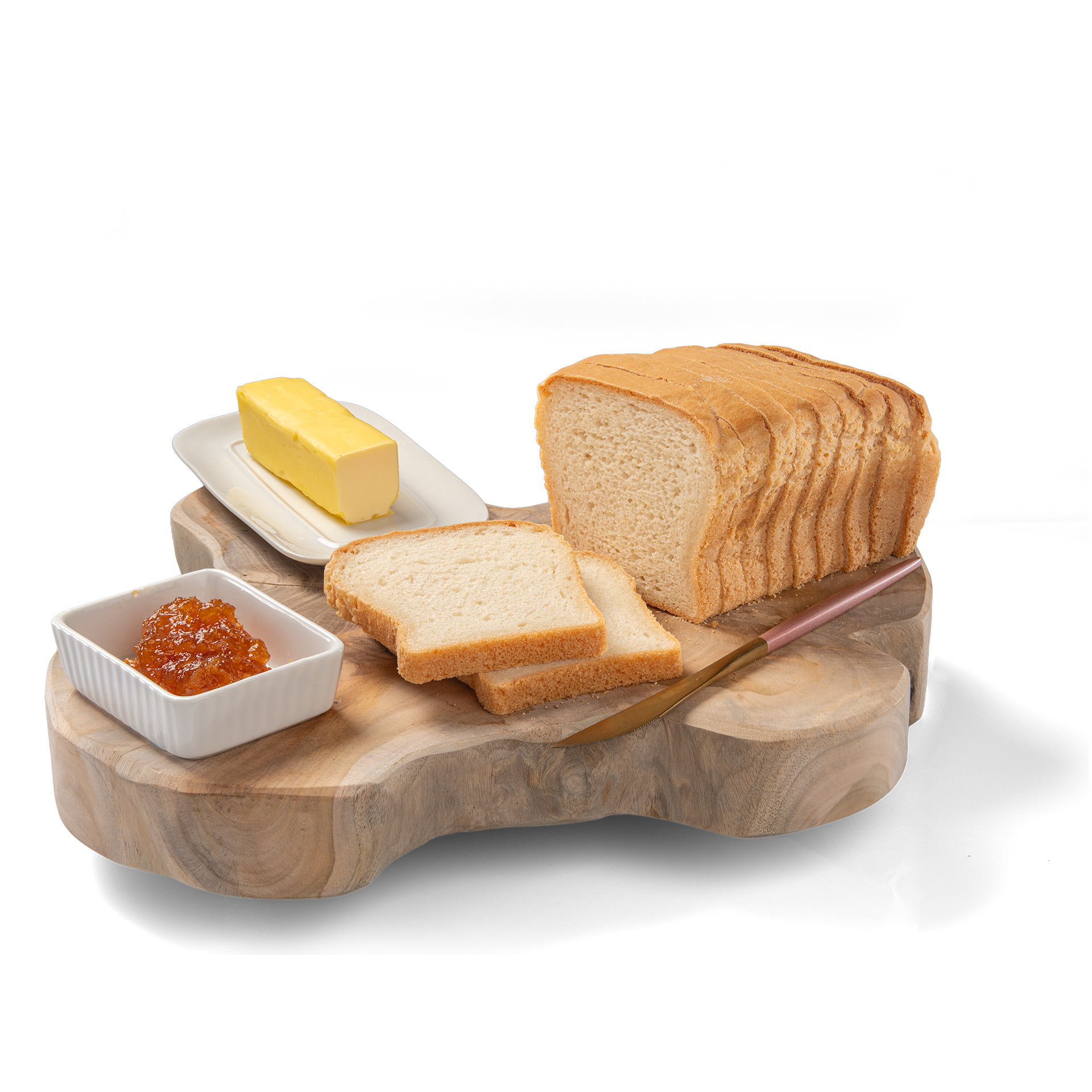 Sliced whole grain bread on wooden board with butter and a dish of jam